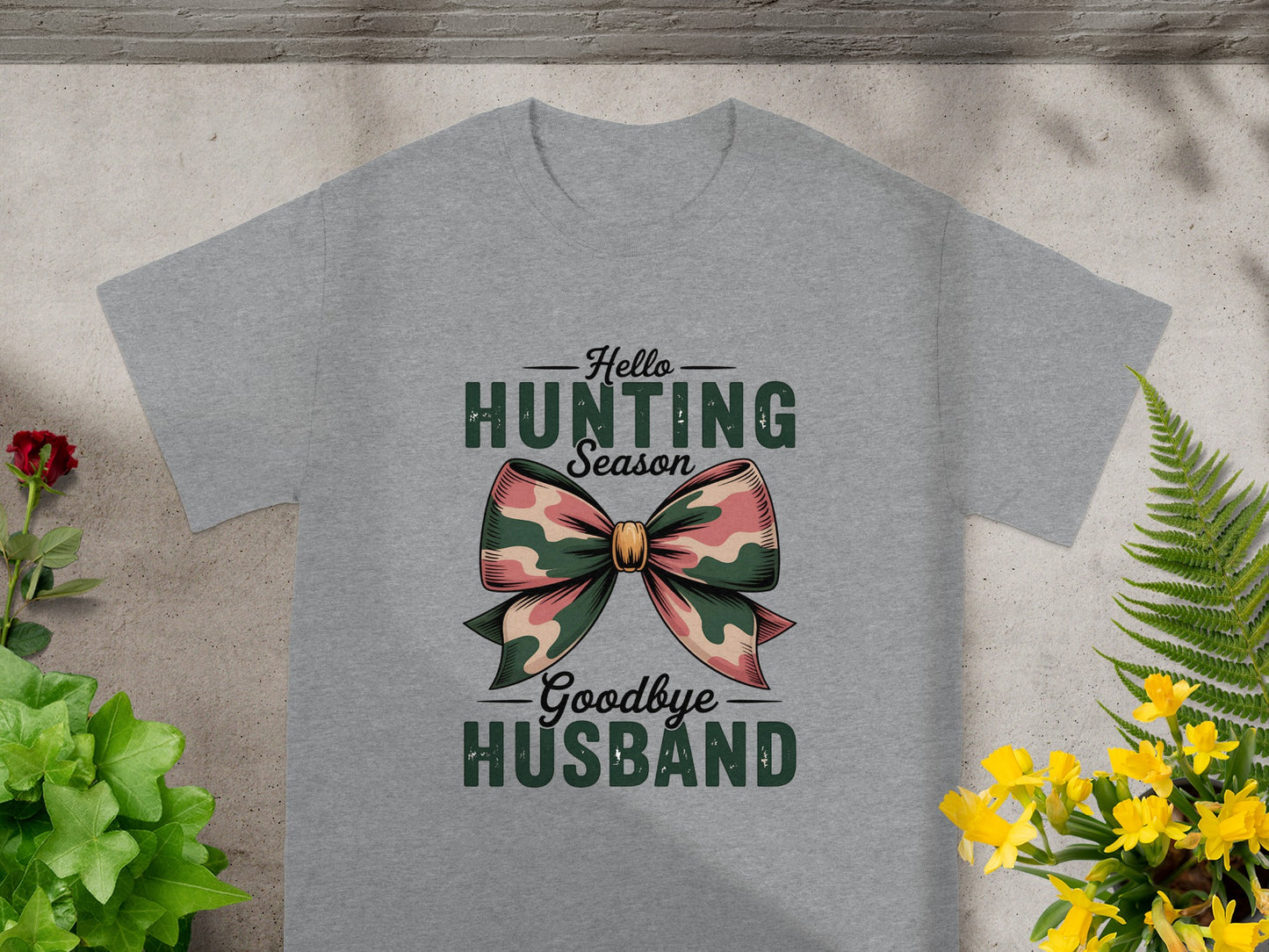 Grey t-shirt with "Hello Hunting Season Goodbye Husband" and a camouflage bow graphic.