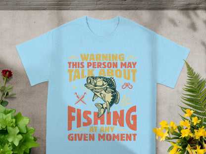 Light blue t-shirt with "Warning this person may talk about fishing" text and bass graphic.