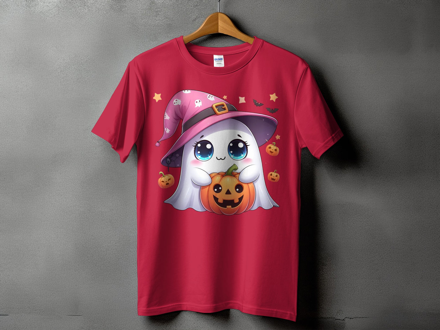 Red t-shirt with a cute ghost character wearing a witch hat and holding a pumpkin.
