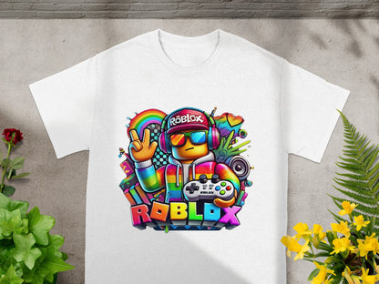 Roblox character in colorful outfit with headphones and game controller on white t-shirt.