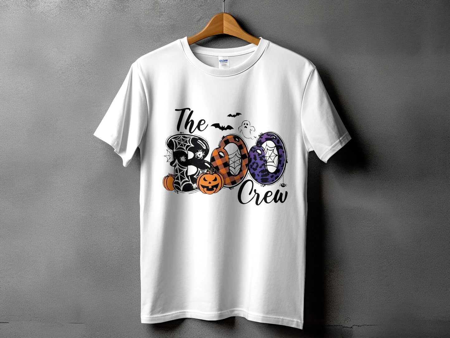 White t-shirt with "The Boo Crew" text featuring Halloween graphics.