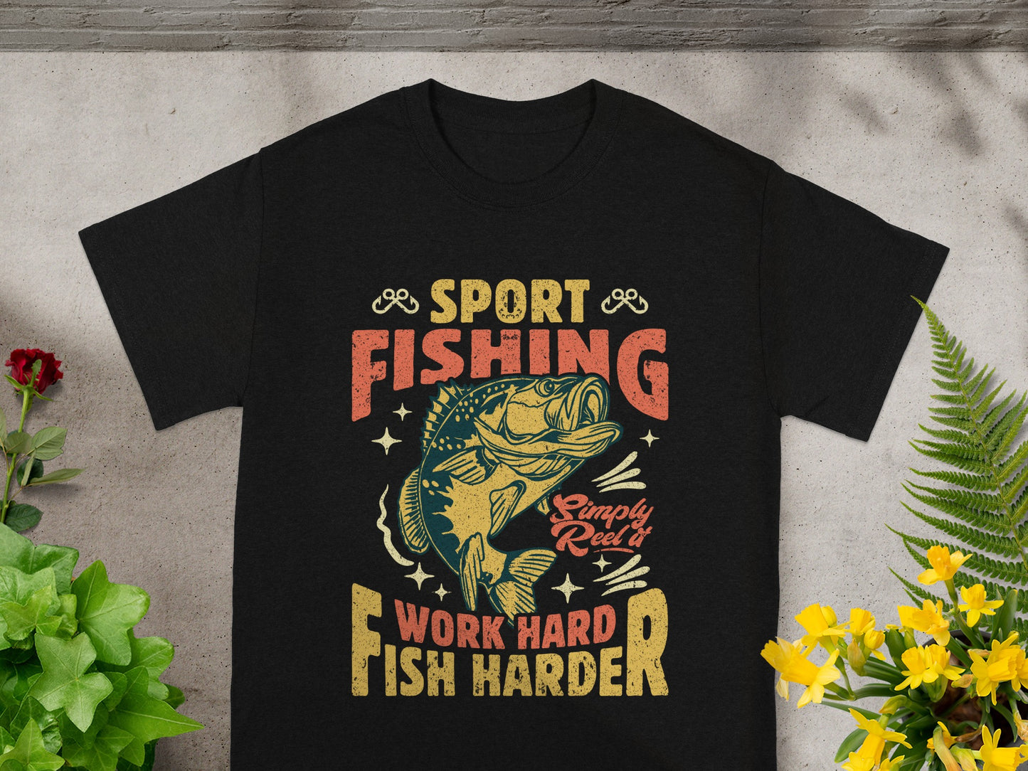 Black t-shirt with "Sport Fishing" and fish graphic, "Simply Reel it", "Work Hard, Fish Harder".