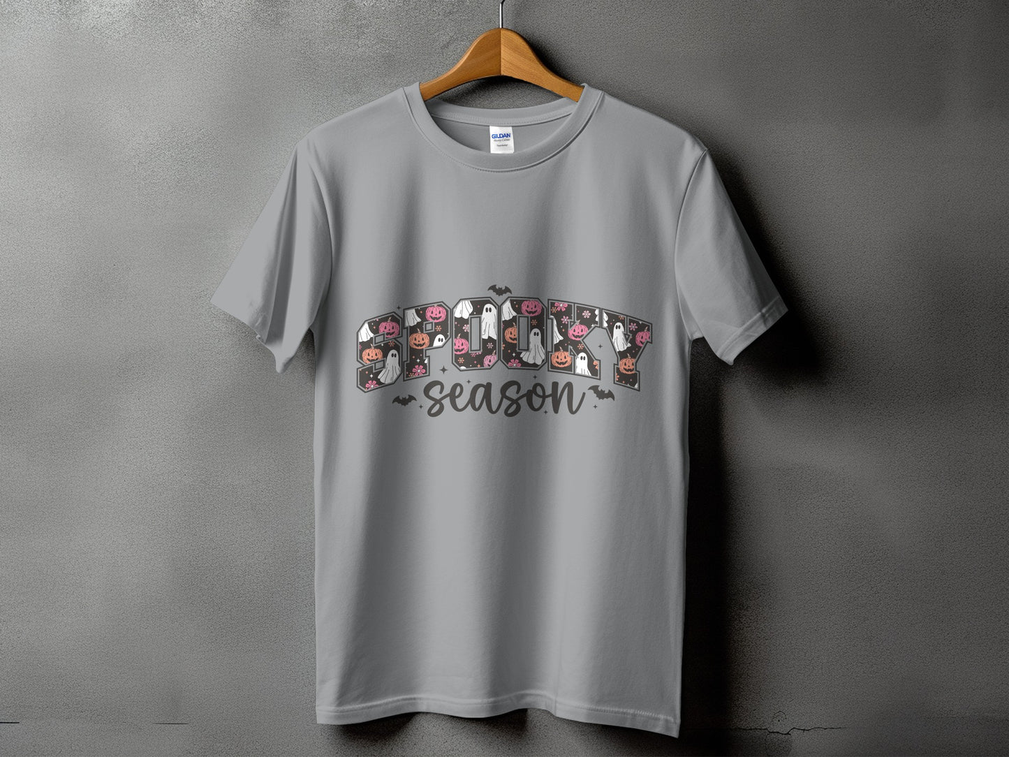 Grey t-shirt with "Spooky Season" text featuring Halloween icons.