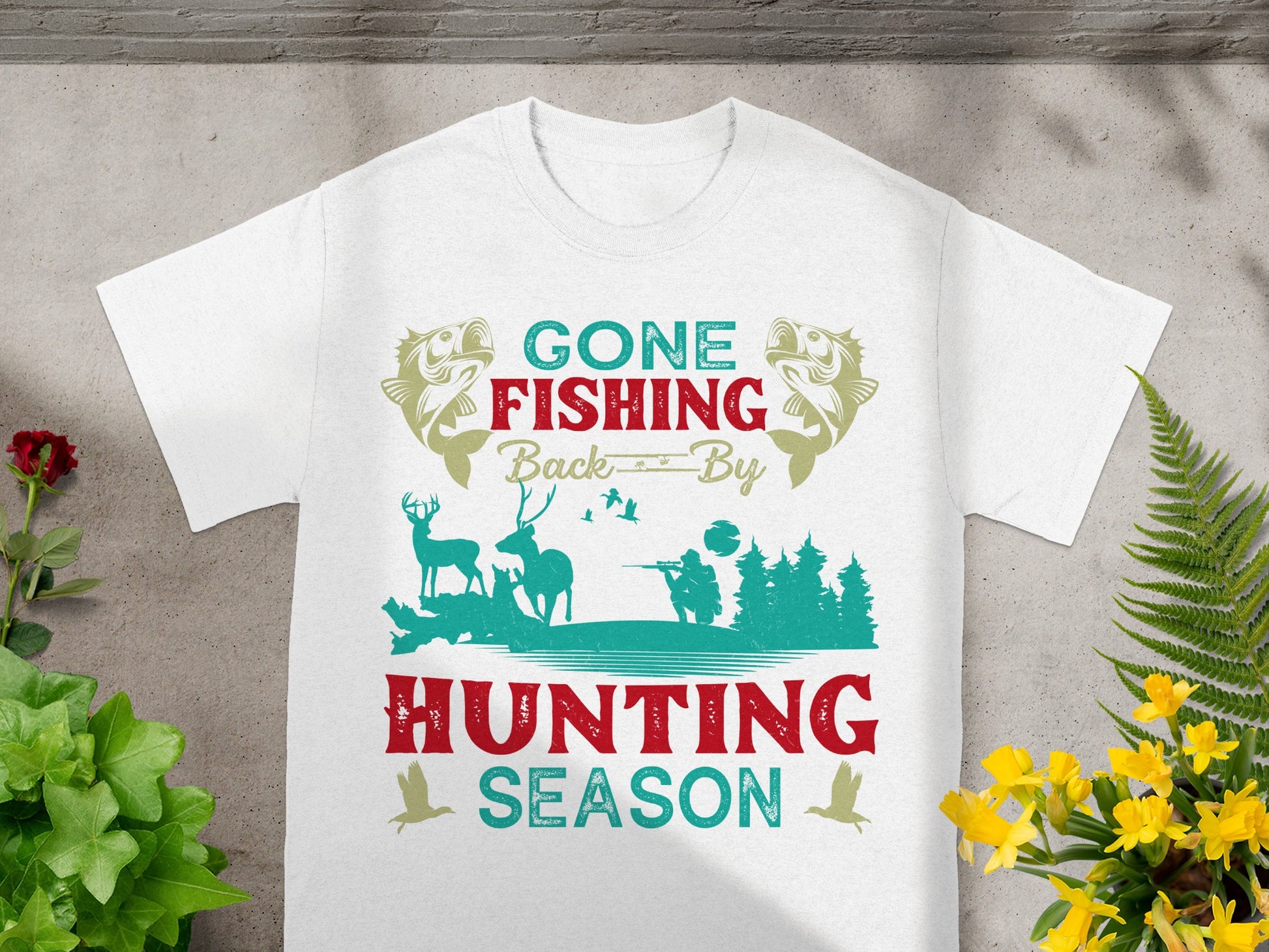 White t-shirt with "Gone Fishing Back By Hunting Season" text and graphics.