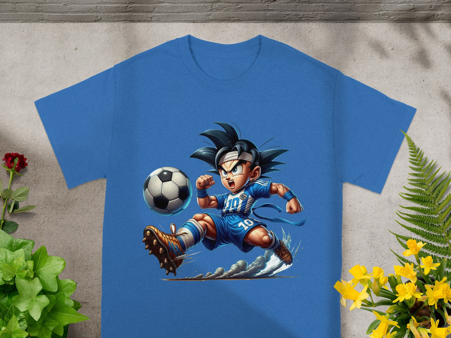Blue t-shirt featuring Goku playing soccer, kicking a ball.