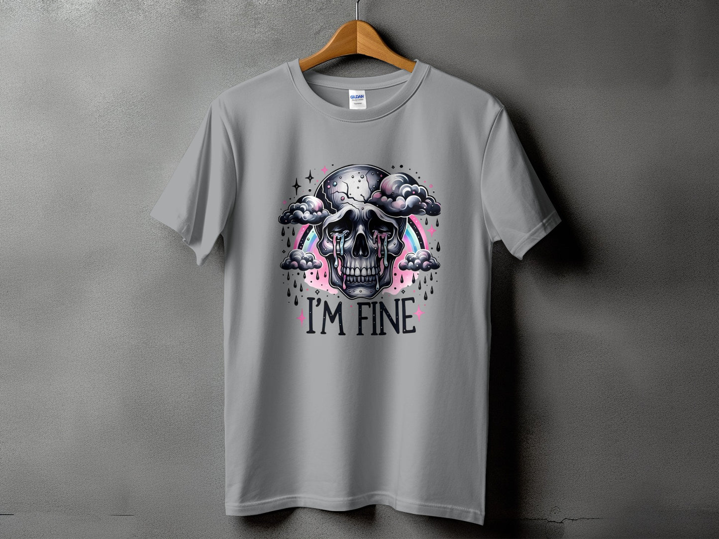 Gray t-shirt with cracked skull crying, clouds, rainbow, and "I'M FINE" text.