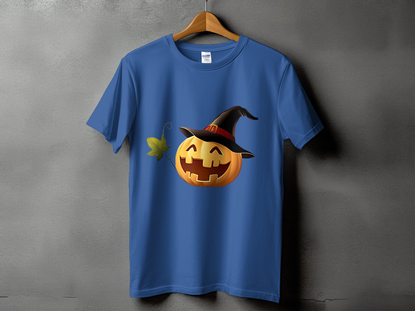 Blue t-shirt featuring a smiling jack-o'-lantern with a witch's hat.