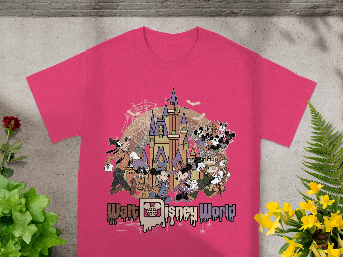 Pink t-shirt with Disney characters, Cinderella Castle, and "Walt Disney World" text.