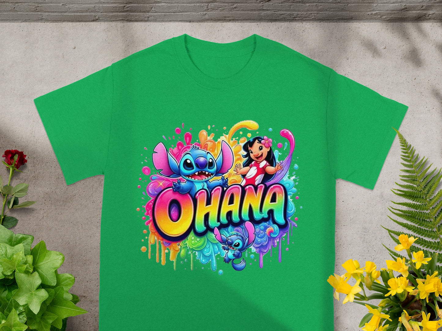 Green t-shirt with colorful Stitch and Lilo "Ohana" graphic.