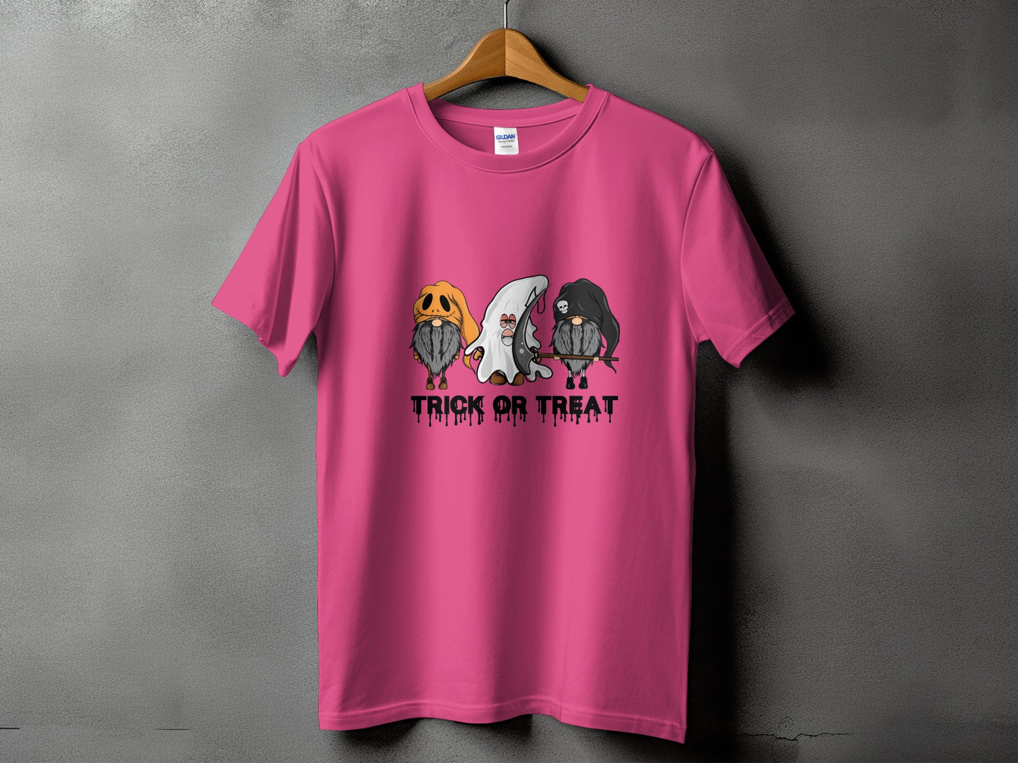 Pink t-shirt with three Halloween gnomes and "Trick or Treat" text.