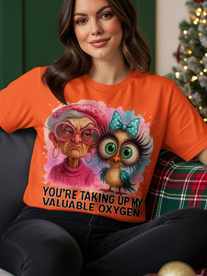 Orange t-shirt with cartoon owl and older woman graphic and text.