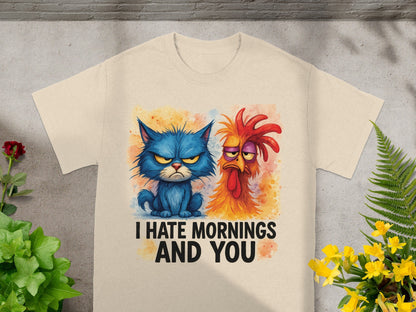 T-shirt graphic of grumpy blue cat and rooster with text "I HATE MORNINGS AND YOU".