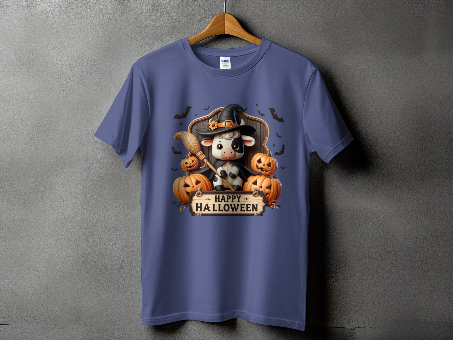 T-shirt with witch cow, pumpkins, broom, bats, and "Happy Halloween" text.
