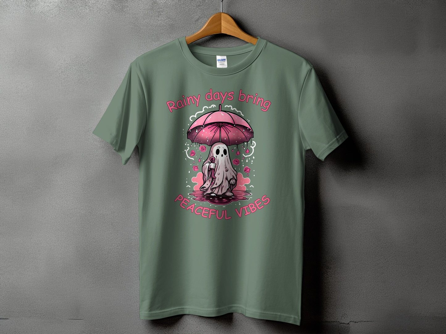 Ghost under pink umbrella with "Rainy days bring peaceful vibes" text.