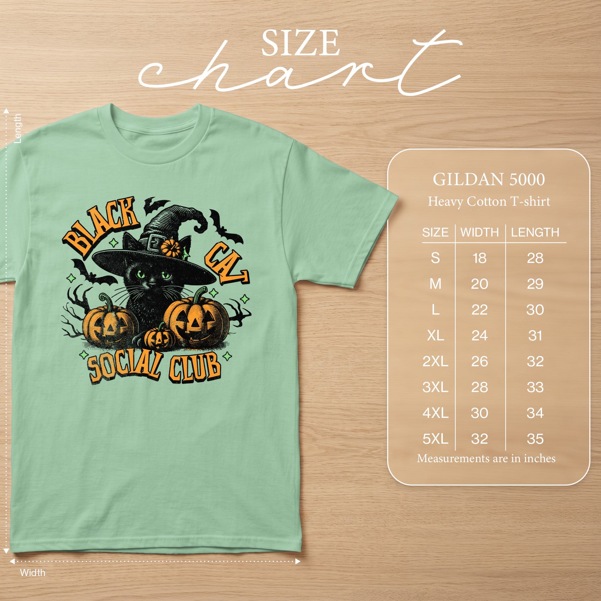 Mint green Gildan 5000 t-shirt with "Black Cat Social Club" Halloween graphic and size chart.