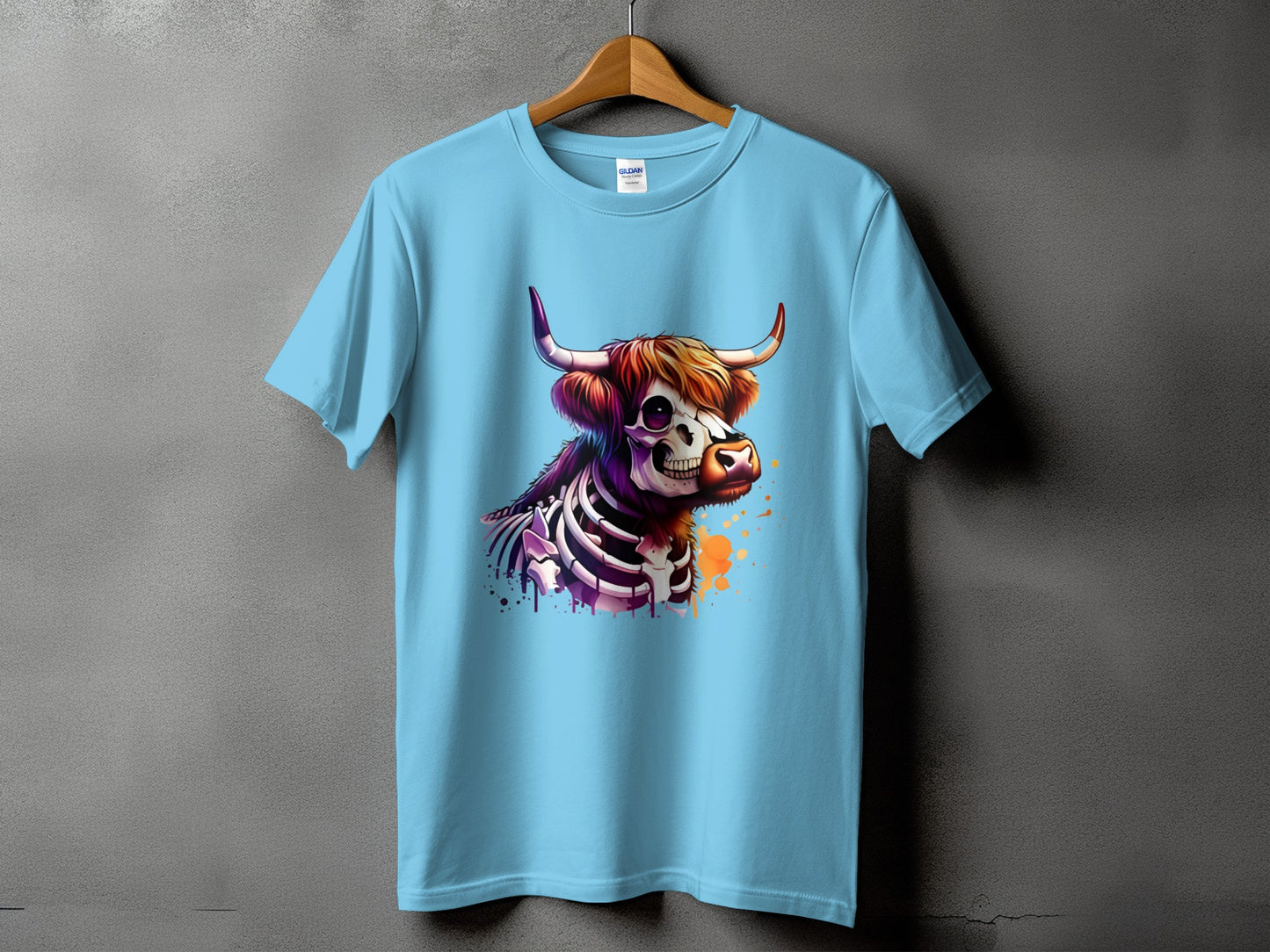 Light blue t-shirt with a colorful skeleton bull graphic and paint splatters.