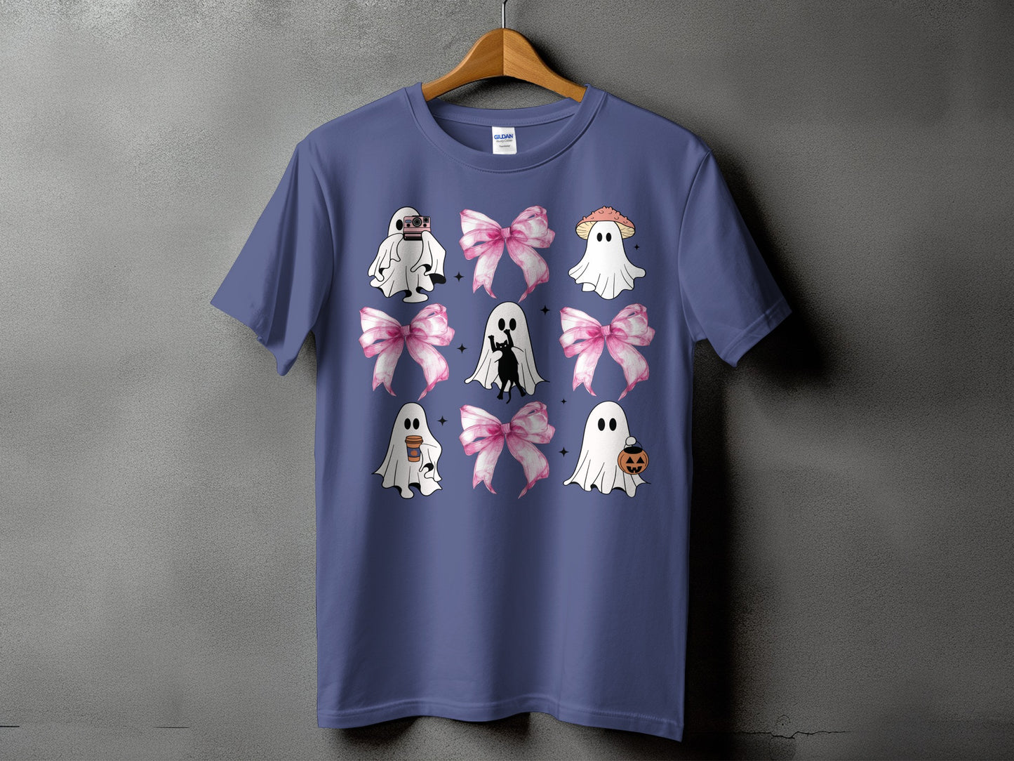 Ghost design with bows and Halloween motifs on a purple t-shirt.