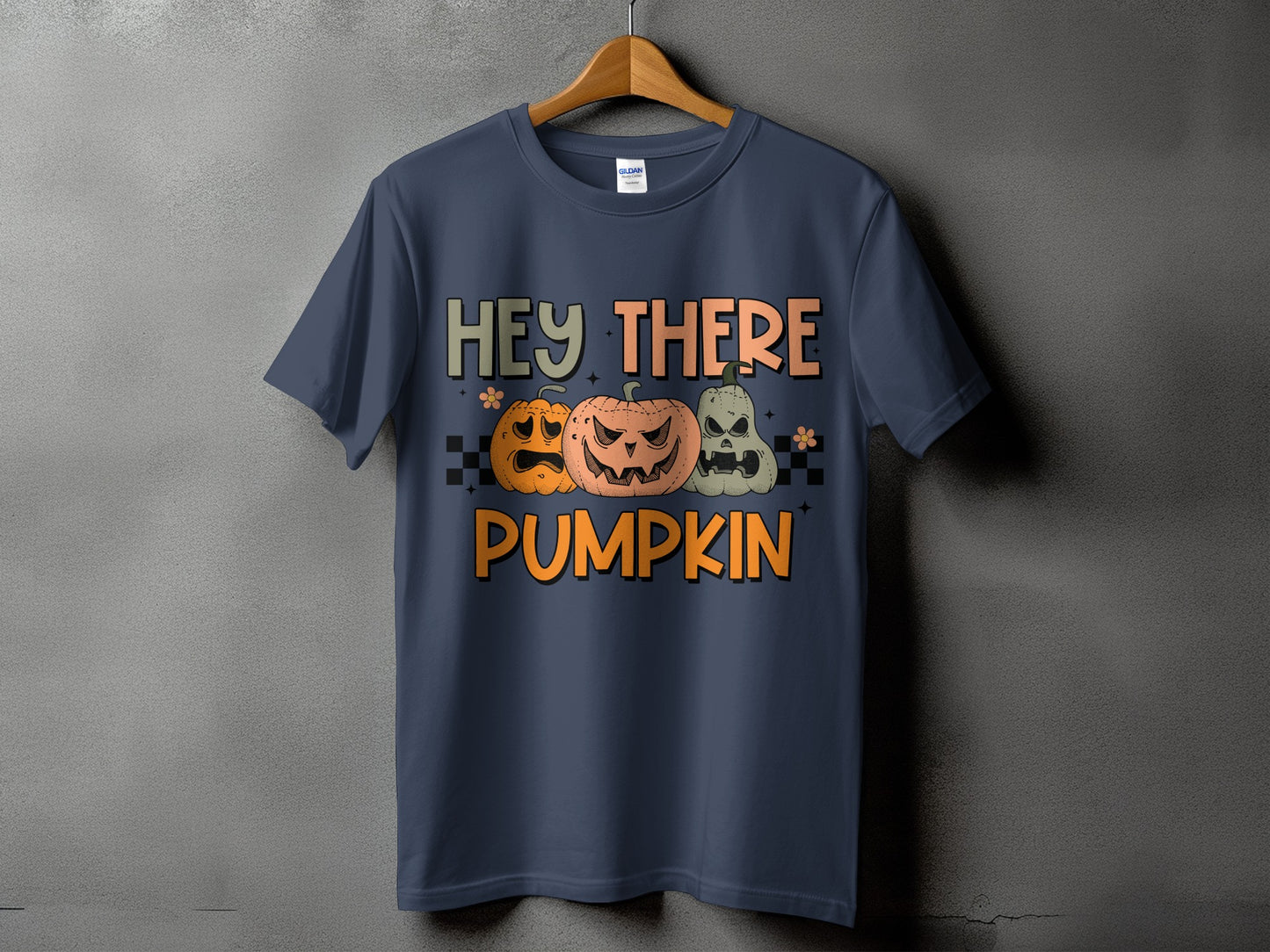 Dark blue t-shirt with "Hey There Pumpkin" text and three Halloween pumpkins.
