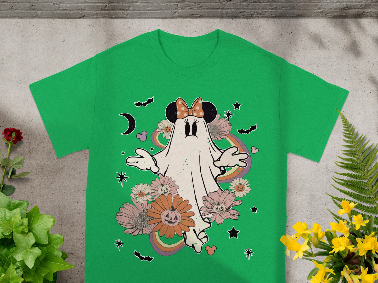 Green t-shirt with a Halloween-themed ghost wearing a Minnie Mouse bow and surrounded by flowers.
