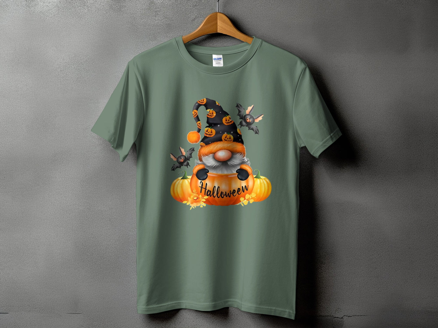Gnome on pumpkins with bats and text "Halloween" on a t-shirt.