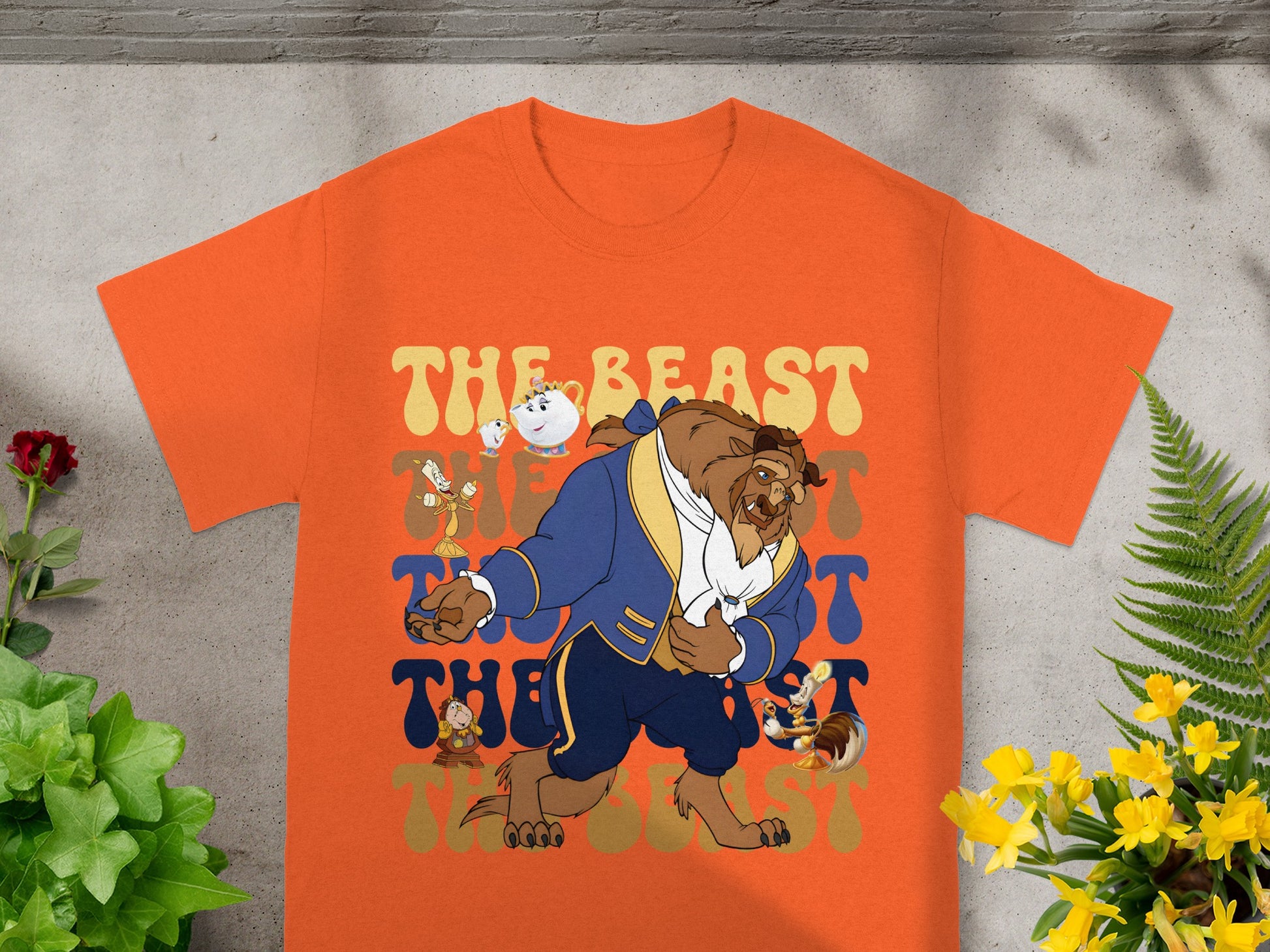 Orange t-shirt with Beast and Chip from Beauty and the Beast in groovy font.