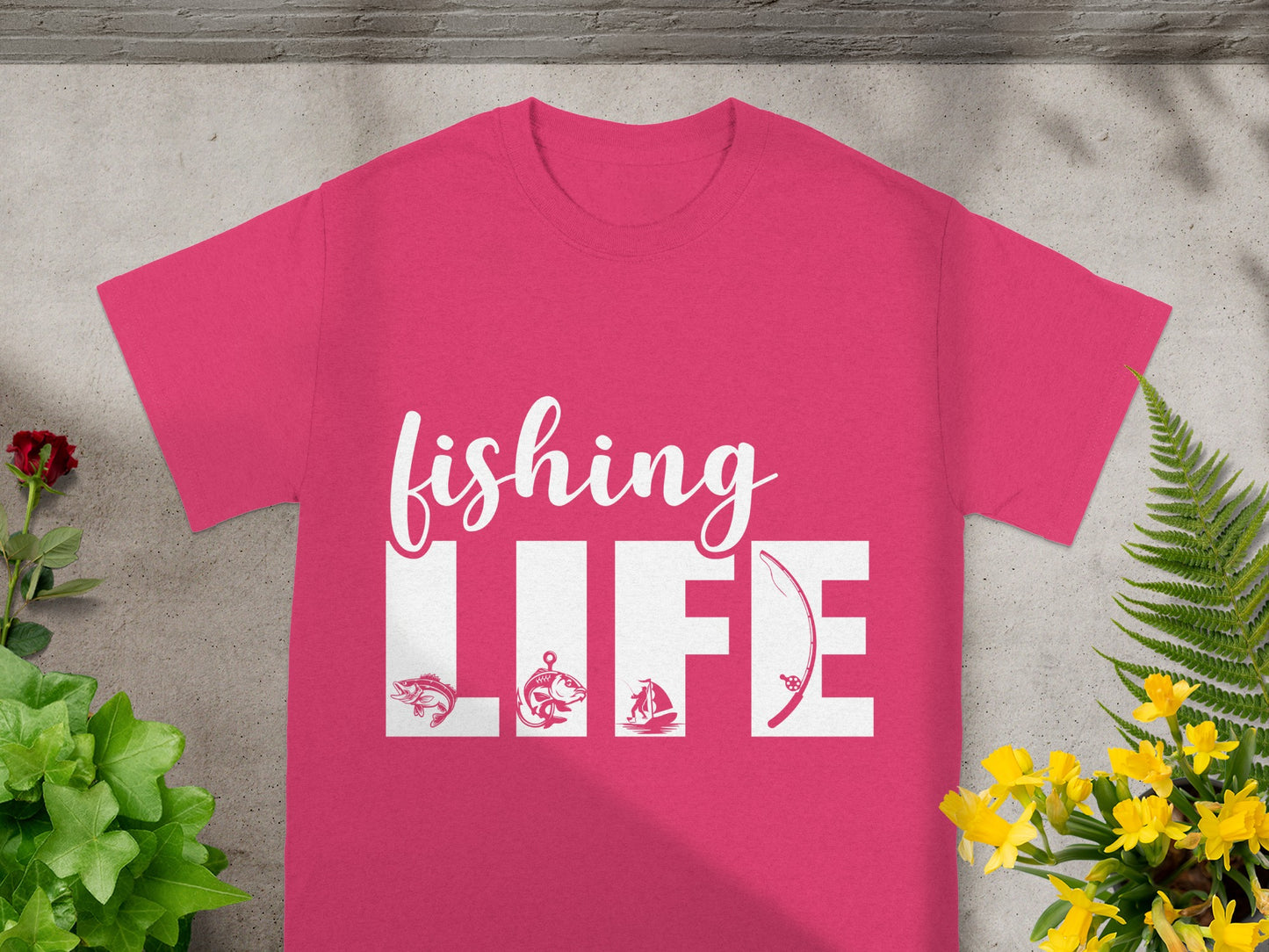 Pink t-shirt with white "fishing LIFE" text and fishing icons.
