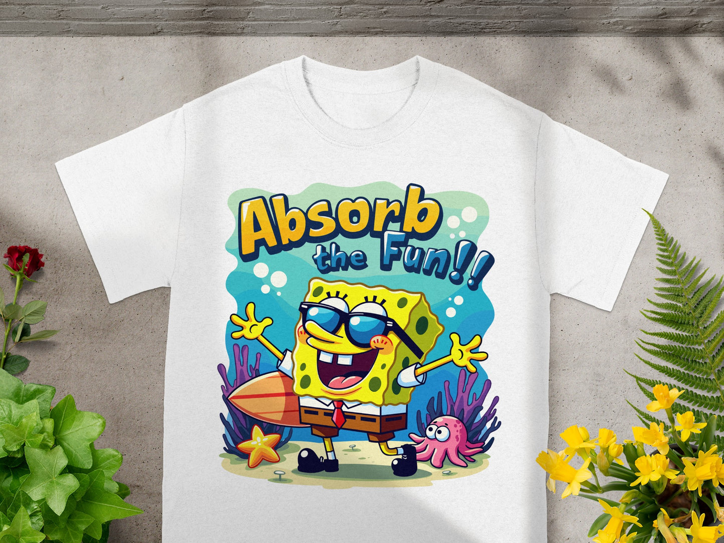 SpongeBob SquarePants shirt reads "Absorb the Fun!!" with surfboard and tentacles.