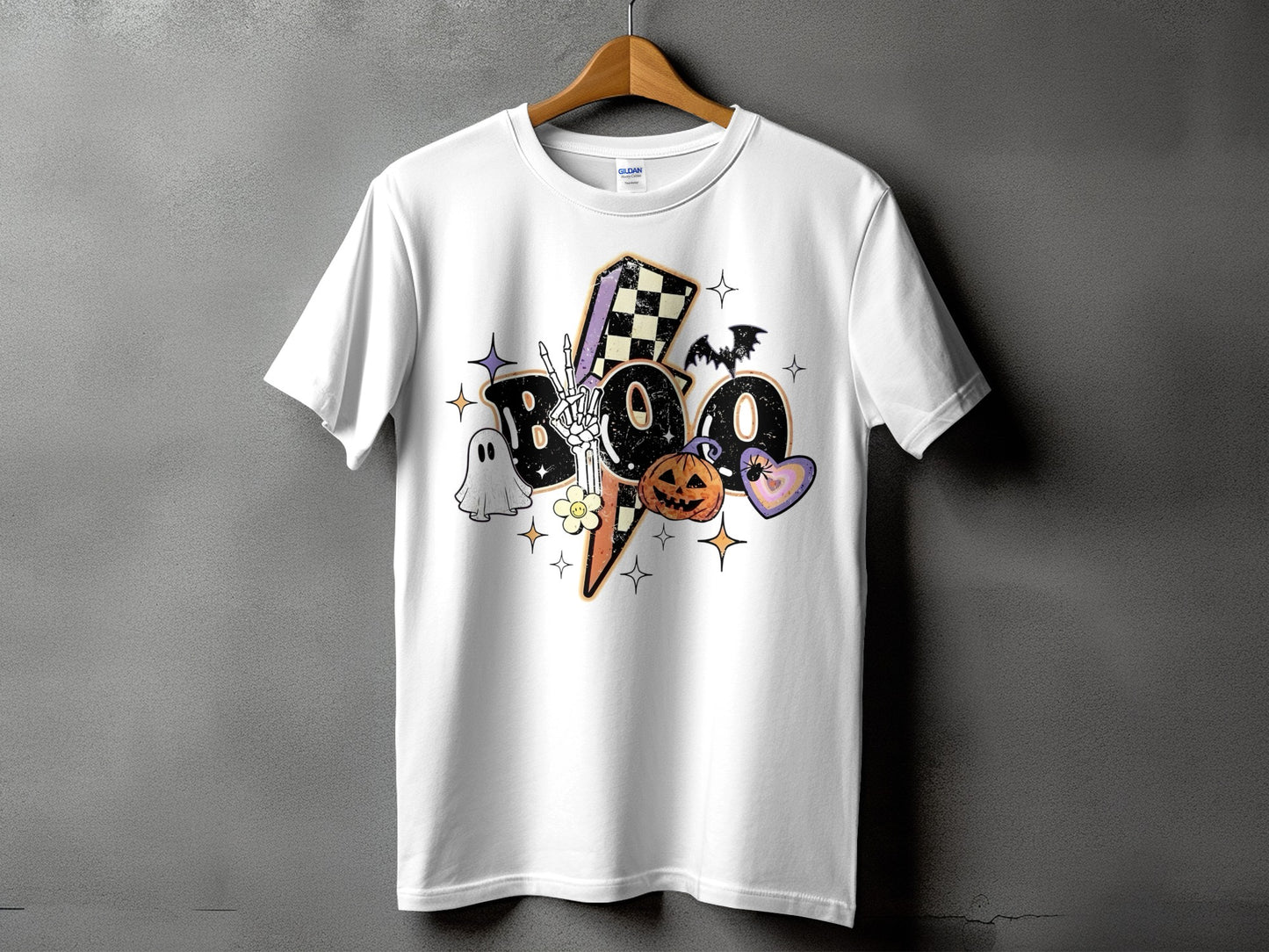 White t-shirt with a Halloween graphic featuring "BOO" and spooky elements.