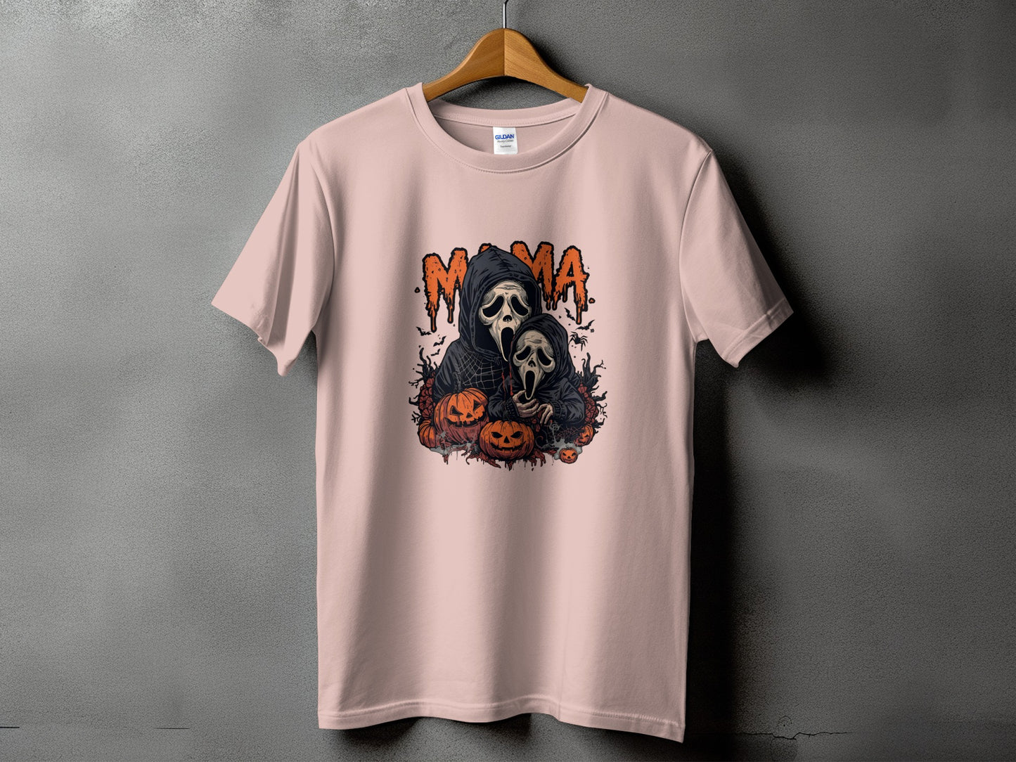 Mama ghost print with pumpkins and bats on a pink t-shirt.