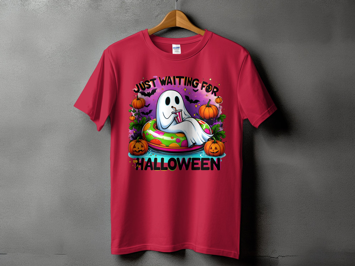 Ghost in inflatable tube with pumpkins and text "Just Waiting For Halloween".