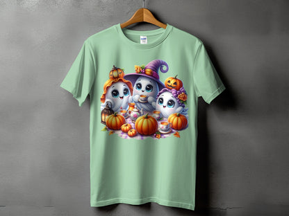 Three cute cartoon ghosts with pumpkins and tea party set on a light green t-shirt.