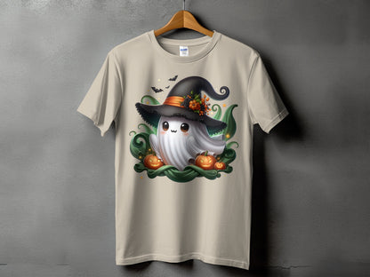 Light tan t-shirt with a cartoon ghost wearing a witch hat and surrounded by pumpkins.