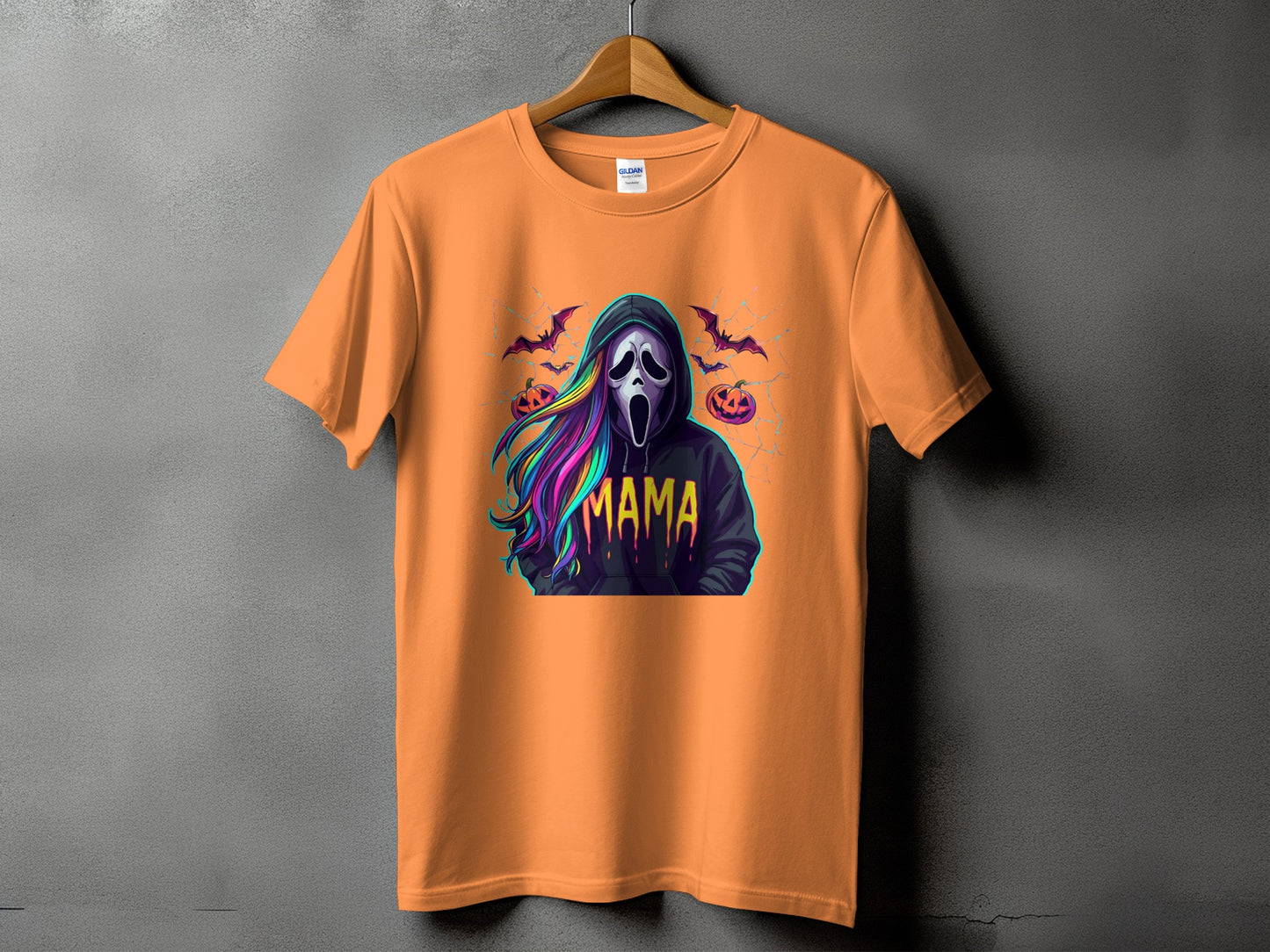 Orange t-shirt with ghost mask, bats, pumpkins, and the word "MAMA".