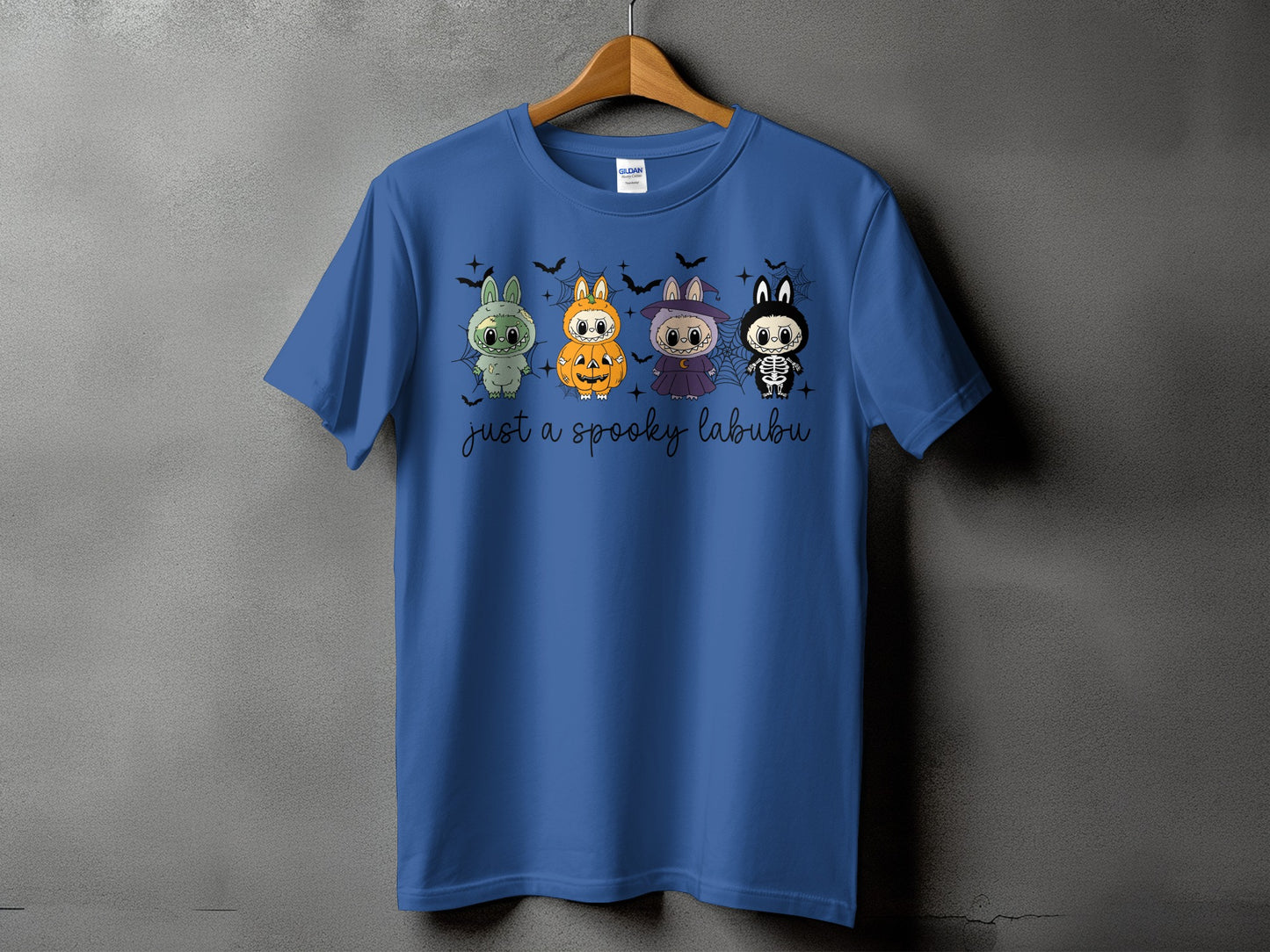 Blue t-shirt with four Halloween-themed characters and the text "just a spooky labubu".