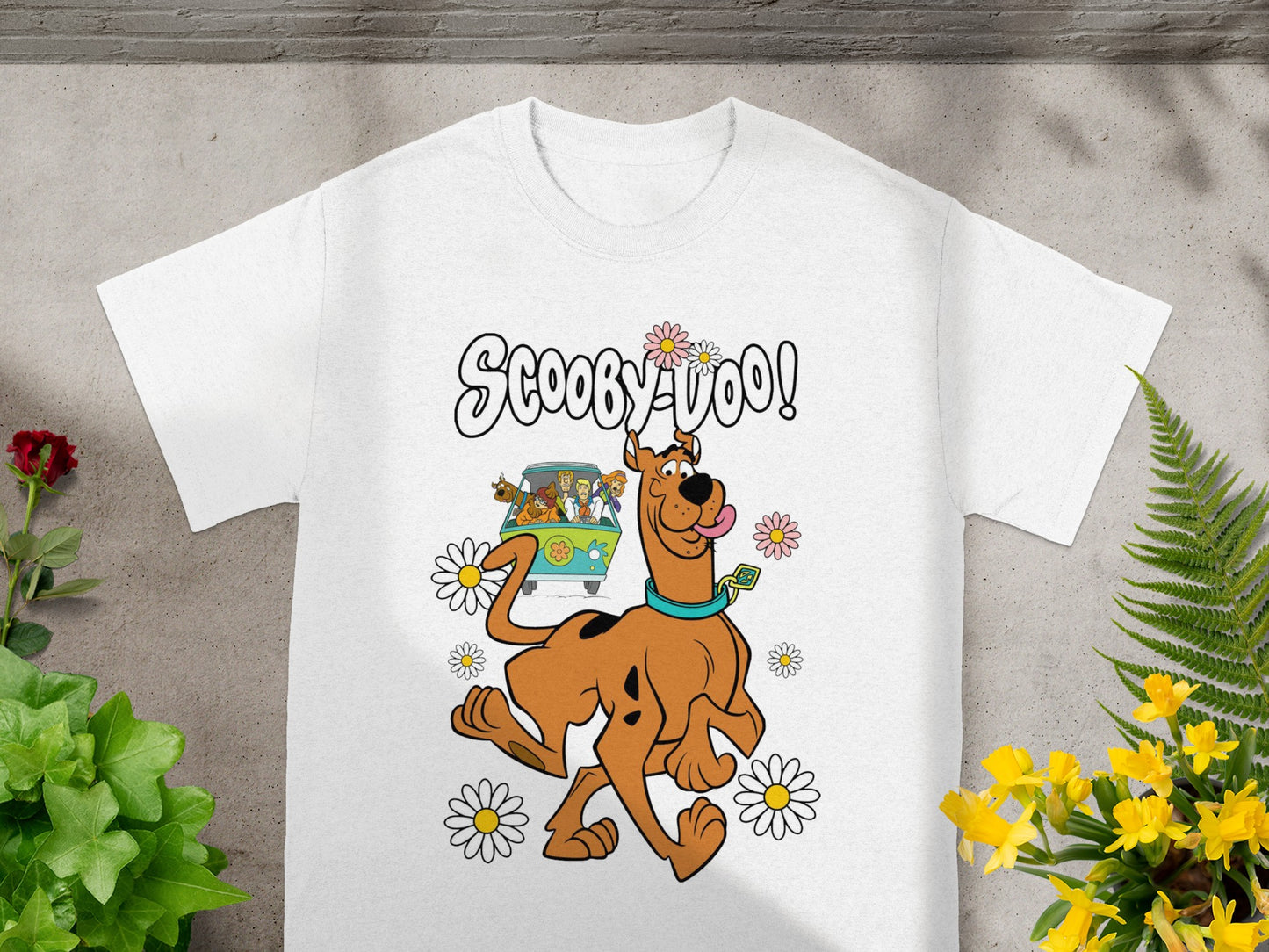 Scooby-Doo graphic with Scooby and Mystery Machine on a white t-shirt.