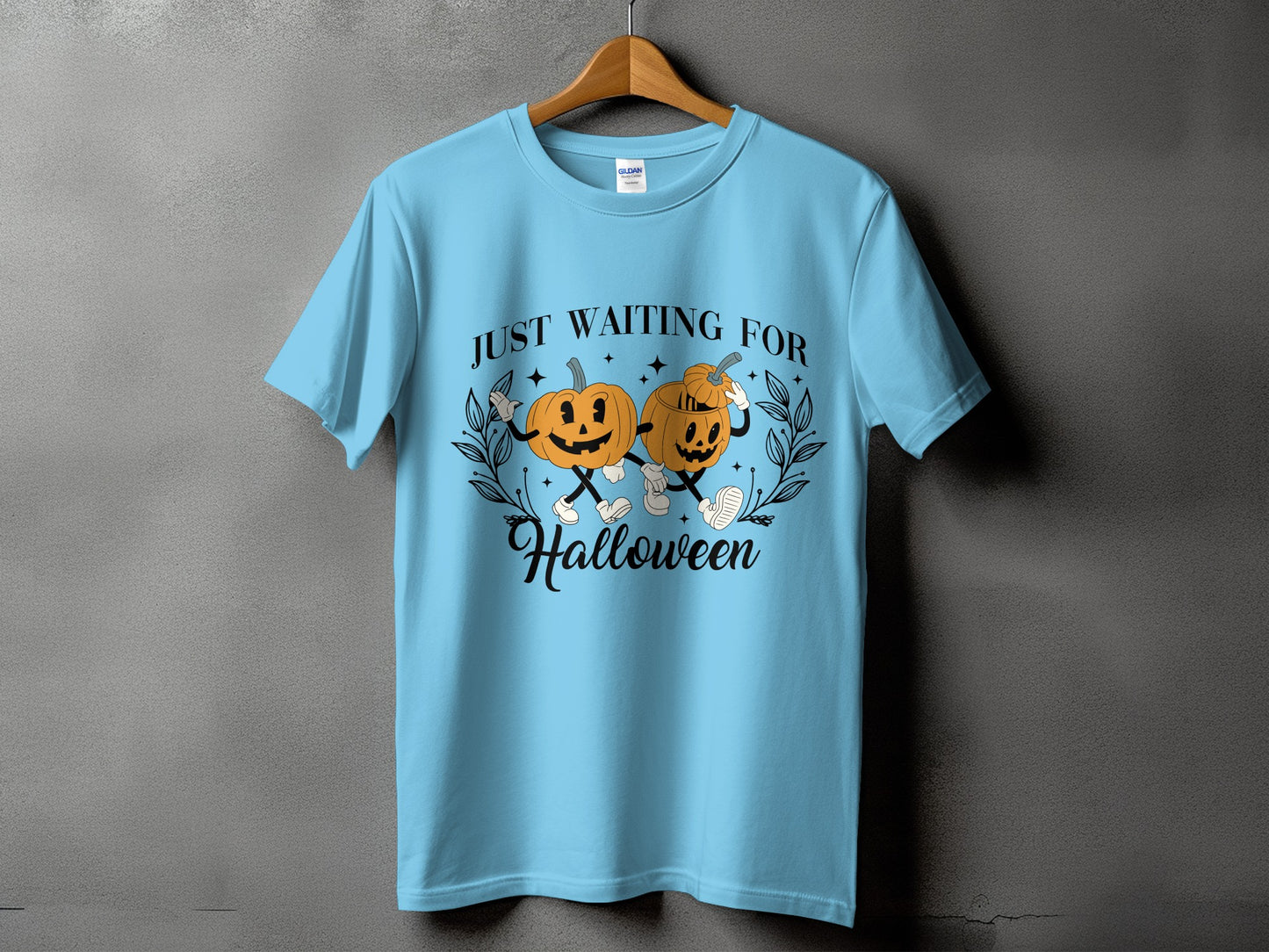 Light blue t-shirt with "JUST WAITING FOR Halloween" and cartoon pumpkins graphic.