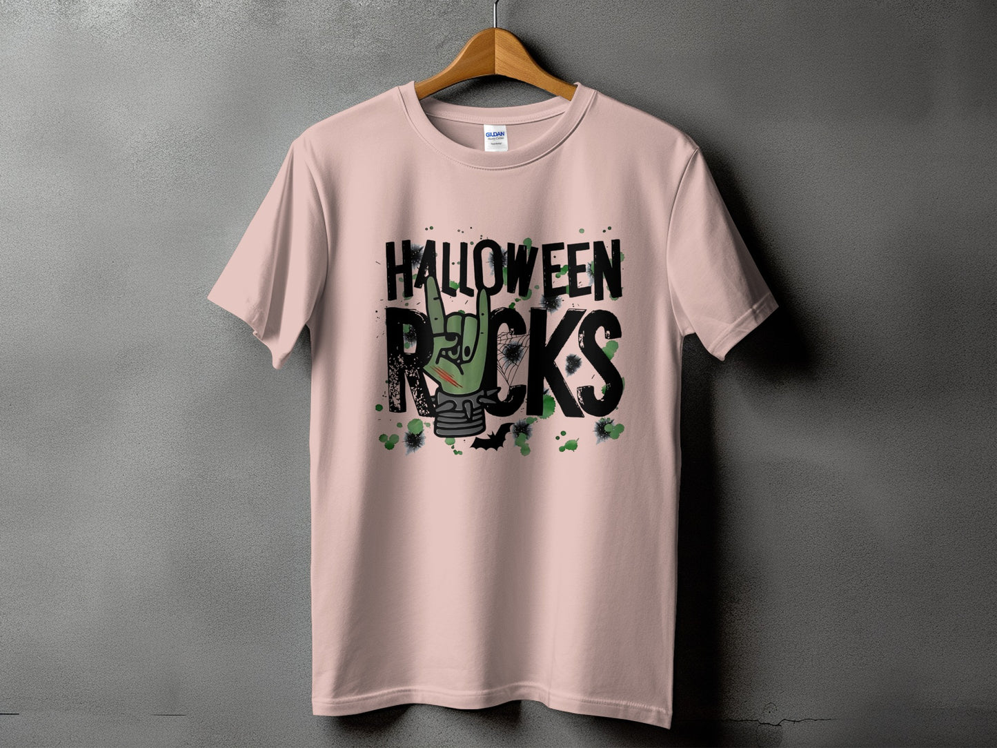 Light pink t-shirt with black text "HALLOWEEN ROCKS" and zombie hand graphic.