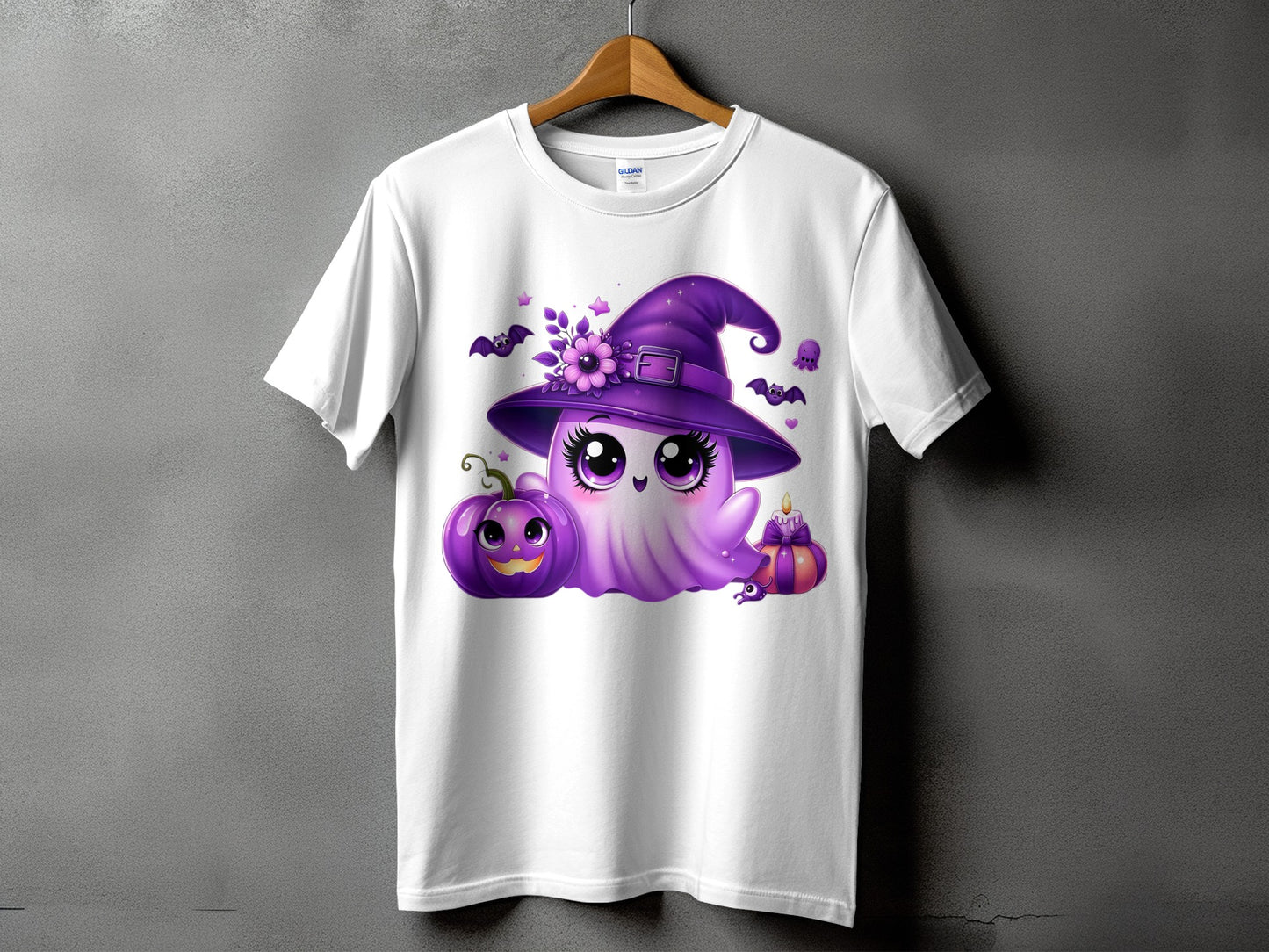 White t-shirt with cute purple ghost wearing witch hat, holding pumpkin and candle.