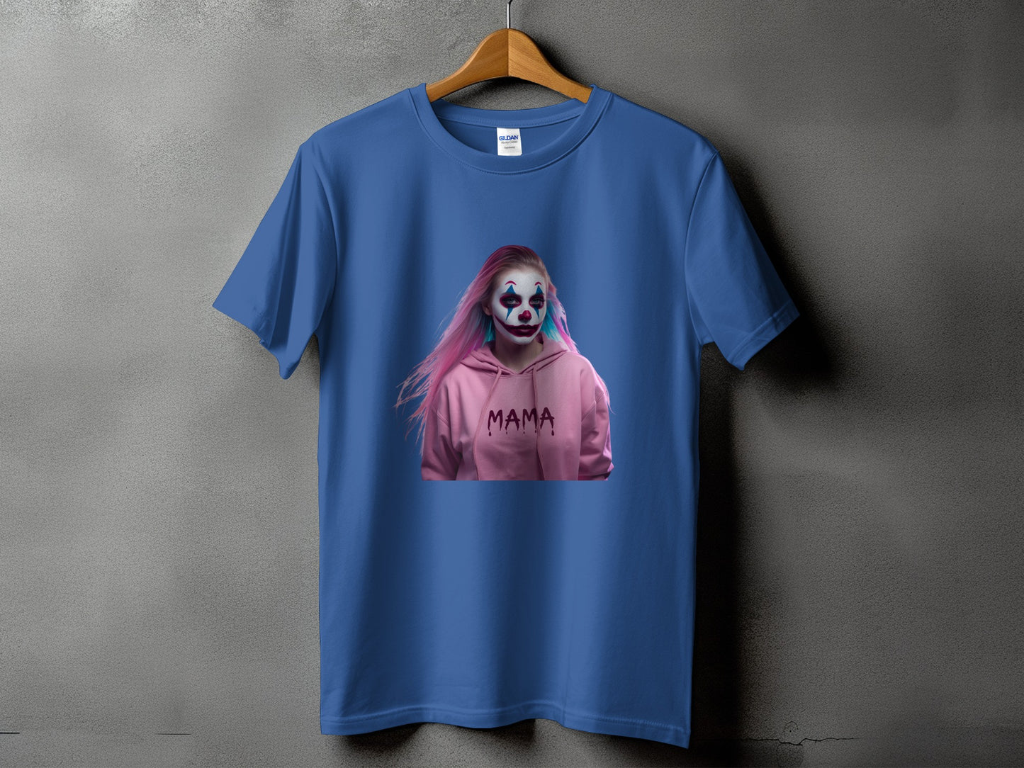 Blue t-shirt with a graphic of a clown wearing a pink hoodie with "MAMA" printed on it.