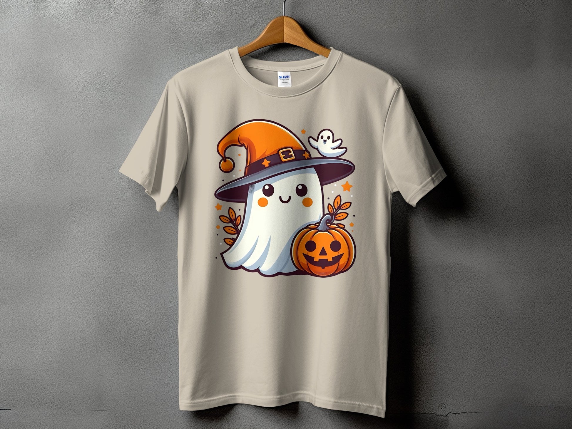 Ghost in witch hat with pumpkin and small ghost, on a light tan t-shirt.