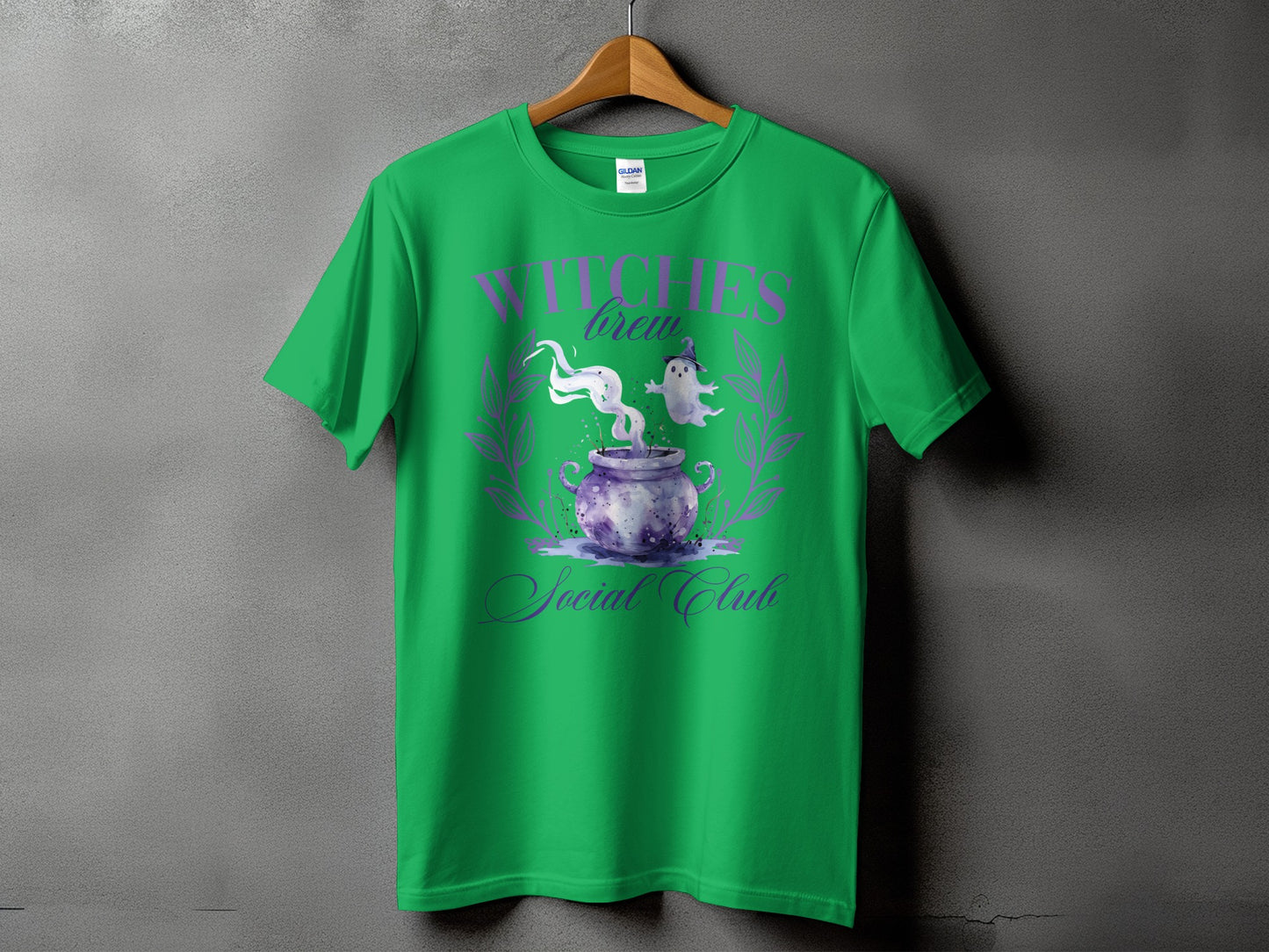 Green t-shirt with "Witches Brew Social Club" text and cauldron graphic.