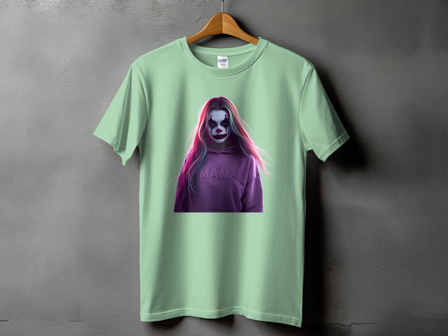 Light green t-shirt with a graphic of a person with clown makeup and "MAMA" text.