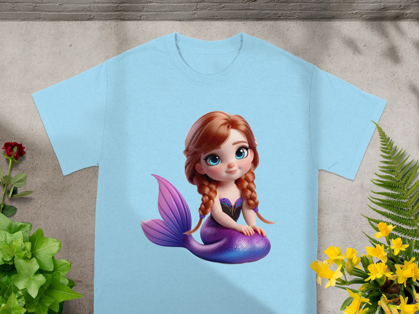 Light blue t-shirt with a cartoon mermaid illustration.
