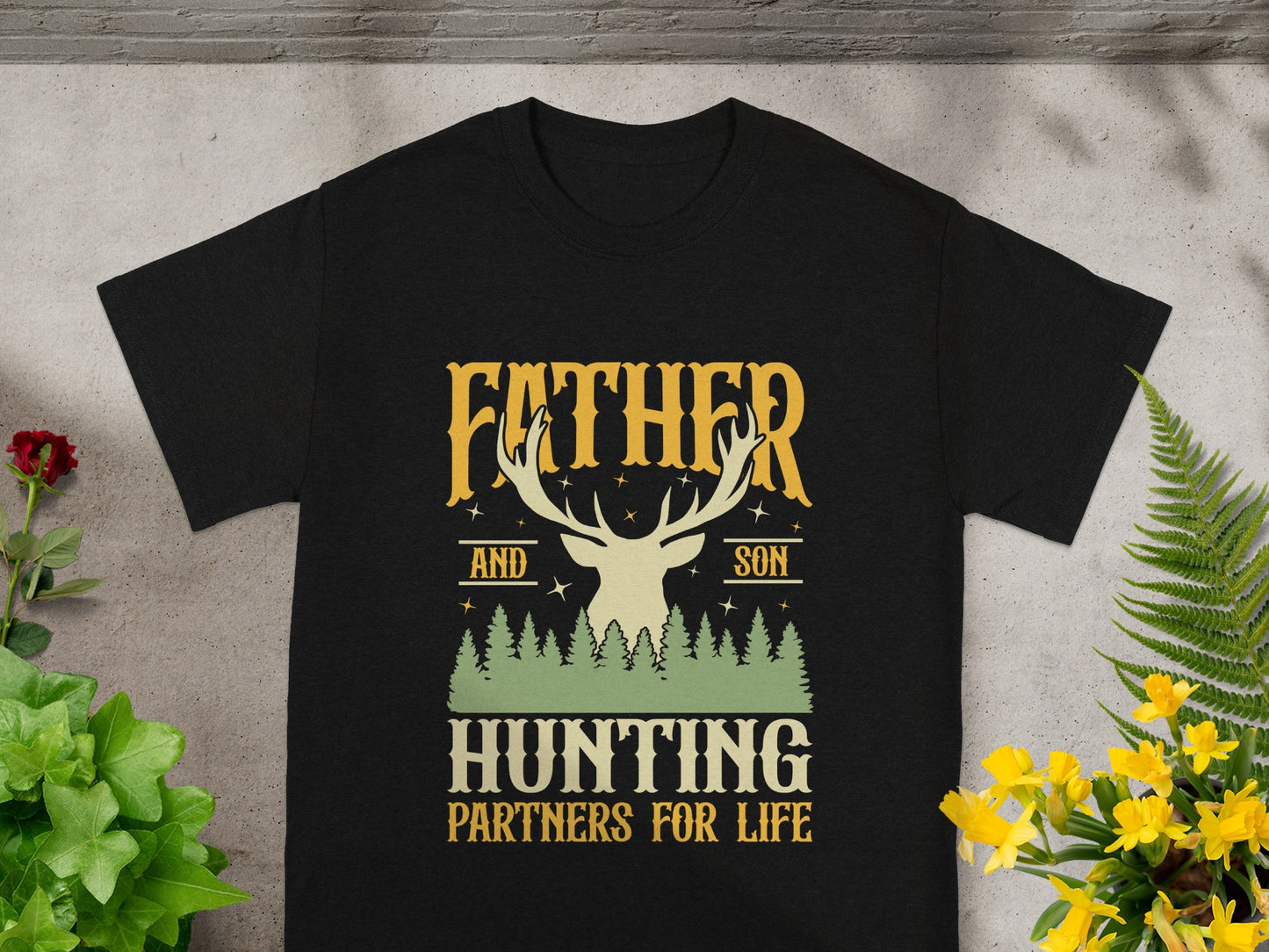 Black t-shirt with deer graphic and text "FATHER AND SON HUNTING PARTNERS FOR LIFE".