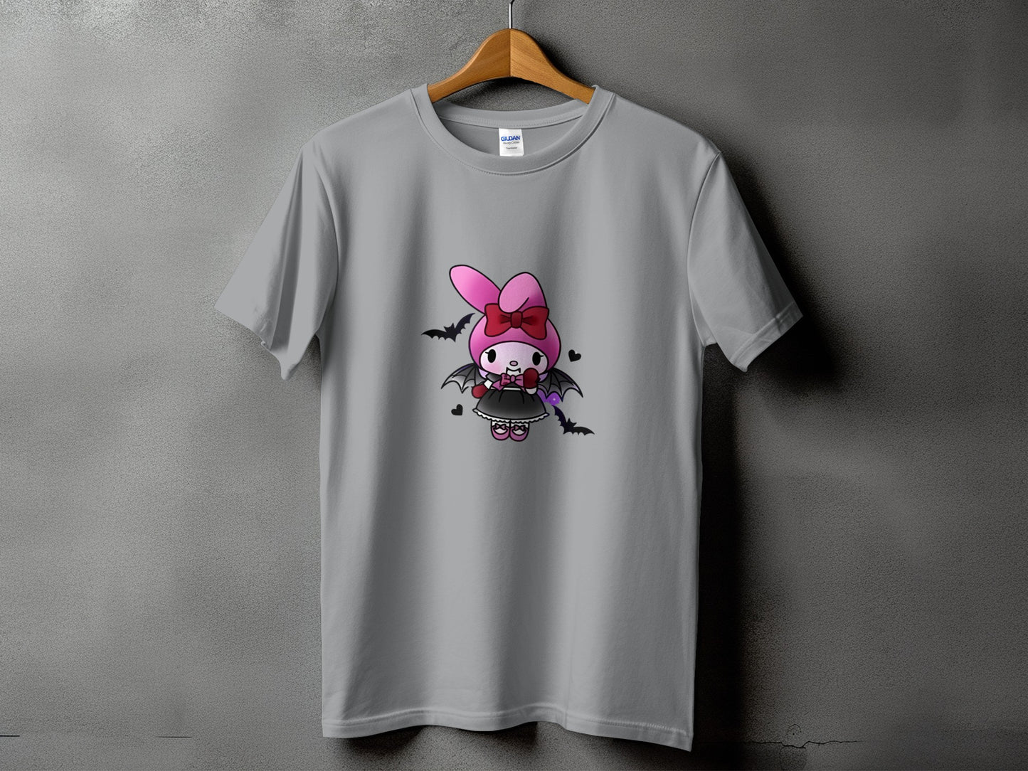 Grey t-shirt featuring a cartoon bunny character dressed as a bat with gothic elements.