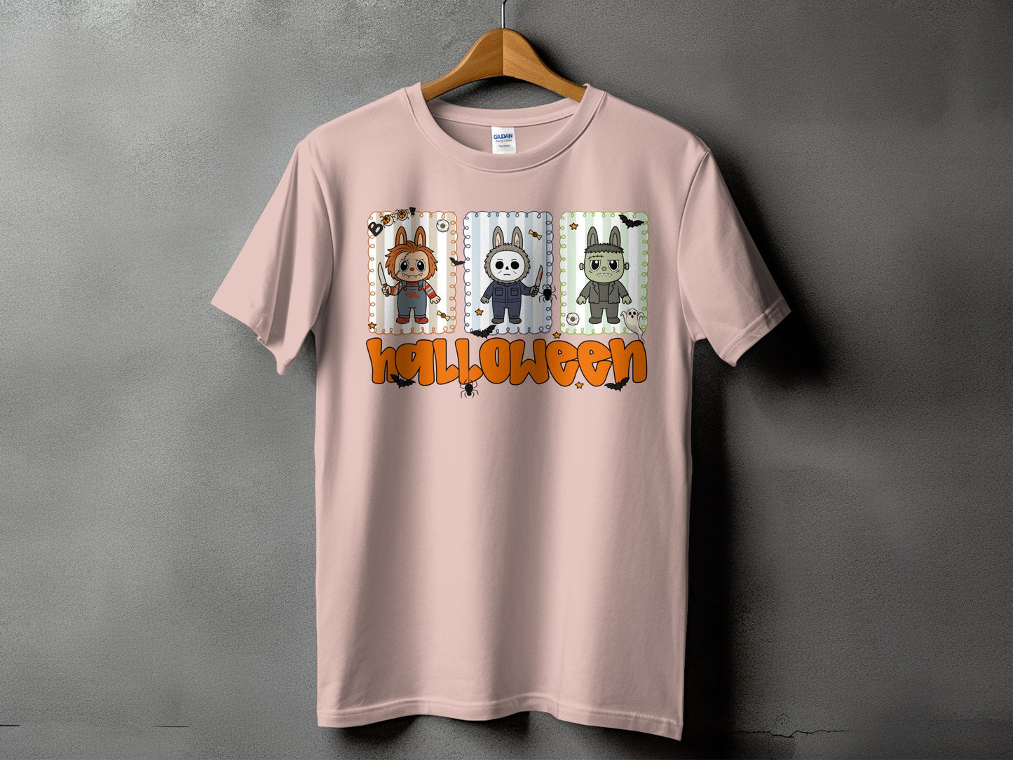 Pink t-shirt with three cartoon characters and "Halloween" text.