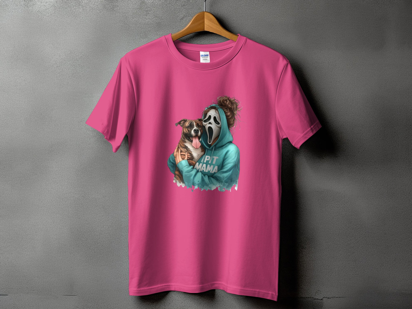Pink t-shirt with a graphic of a person in a Ghostface mask holding a pit bull, text says "PIT MAMA".