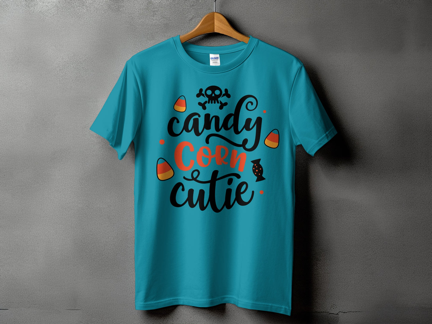 Teal t-shirt with "Candy Corn Cutie" and Halloween graphics.
