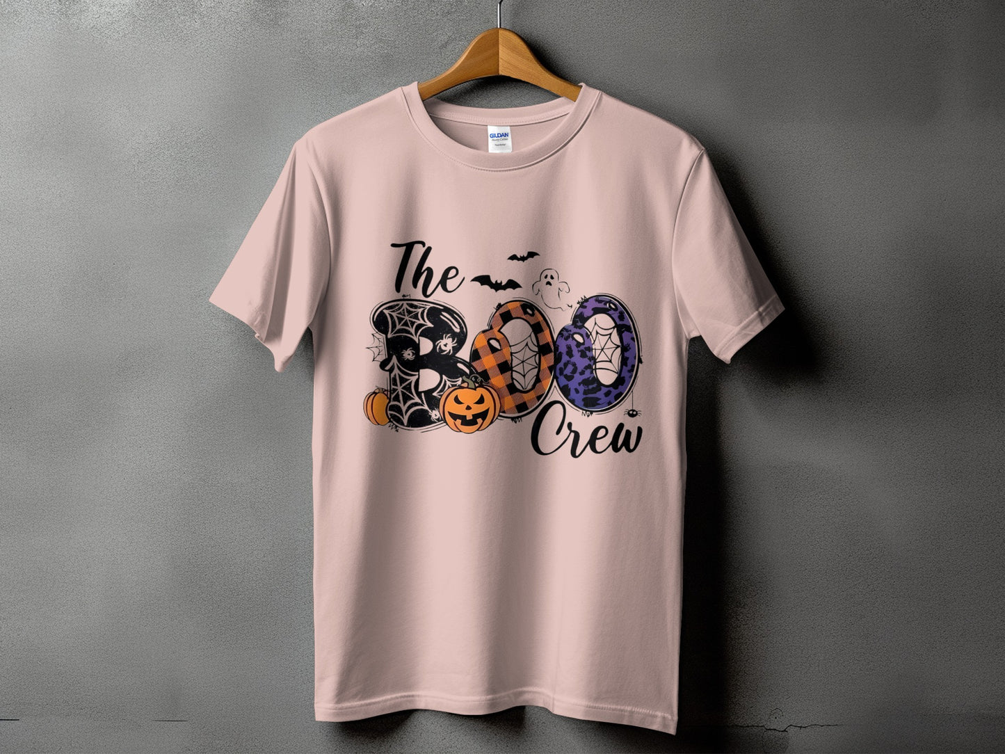 Light pink t-shirt with "The Boo Crew" Halloween graphic.