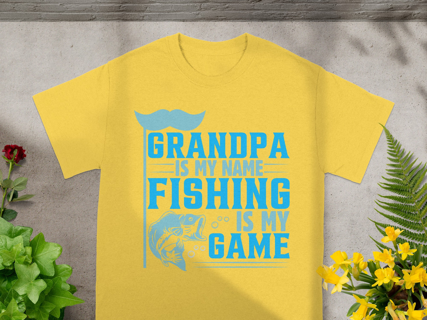 Yellow t-shirt with text "GRANDPA IS MY NAME FISHING IS MY GAME".